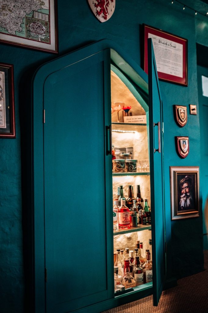 Warm and sophisticated snug showing hidden bar