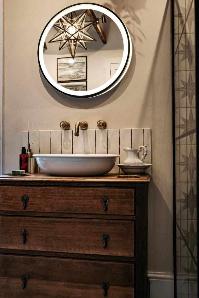 Interior Design of an elegant and traditional bathroom sink area with cabinet and mirror