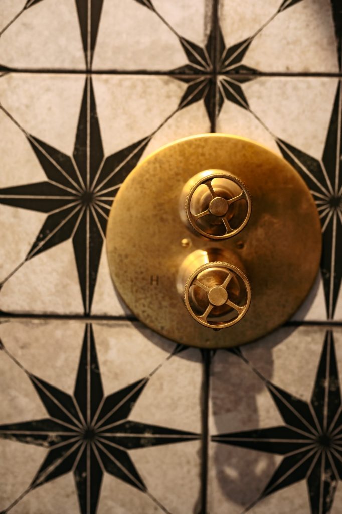 Interior Design of an elegant and traditional bathroom gold shower