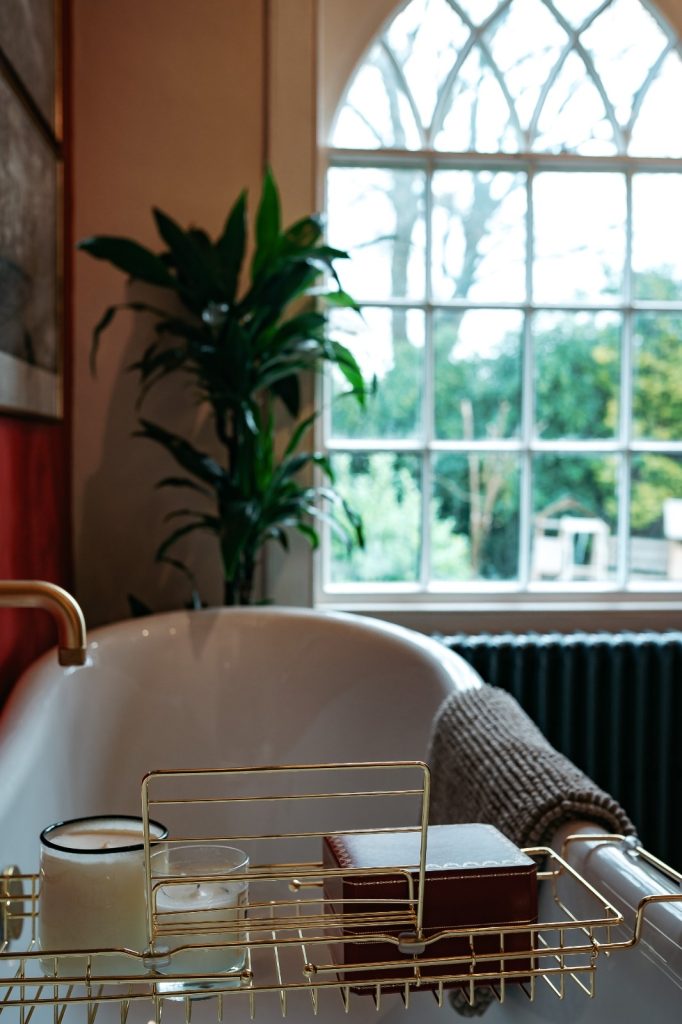 Interior Design of an elegant and traditional bathroom showing the bath and window