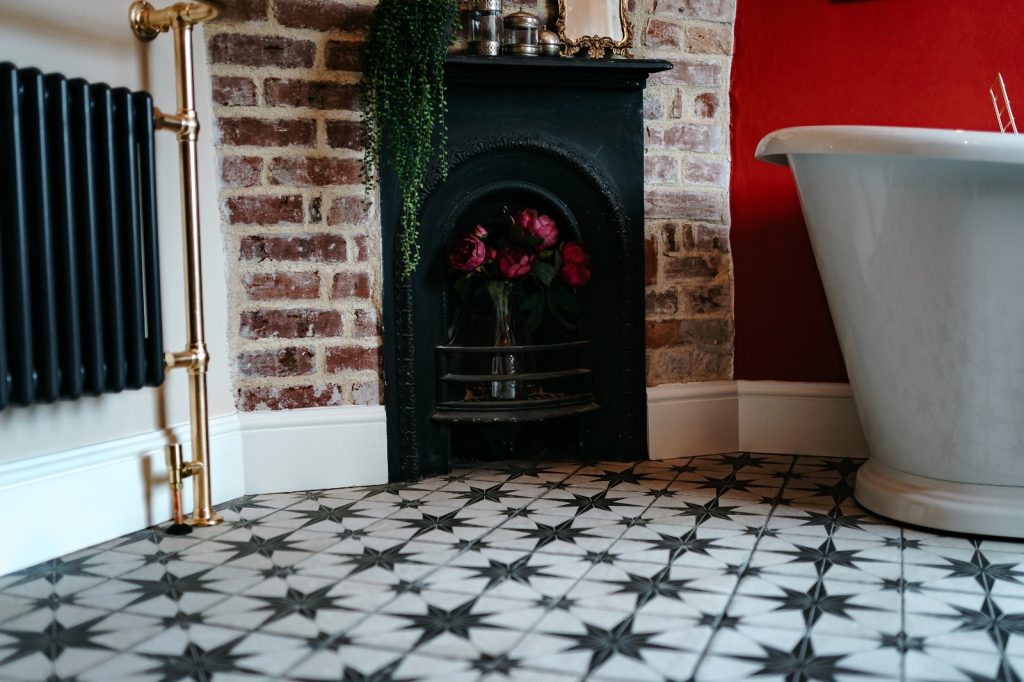 Interior Design of an elegant and traditional bathroom showing fire place
