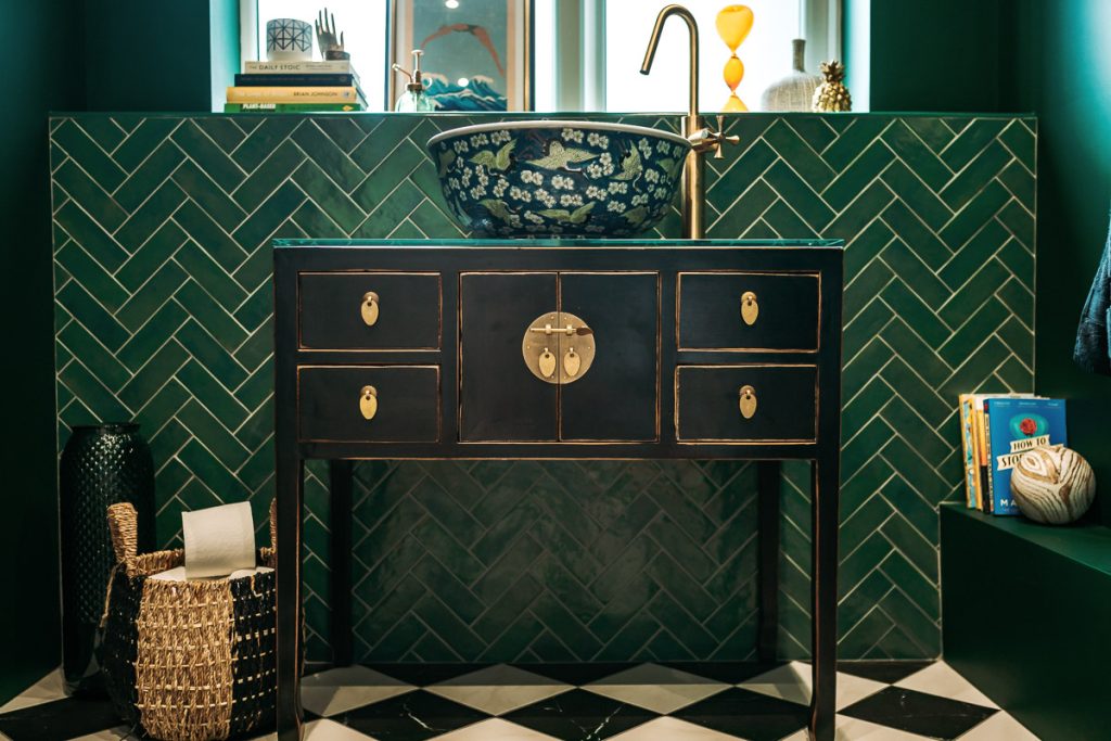 Glamorous downstairs loo focus on sink